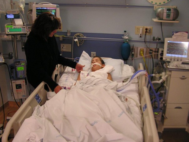Kyle in the hospital with his mom by his side.
