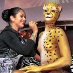 Georgette Pressler body painting a cheetah design
